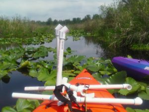 Lee Cuesta kayak in Catherine Creek wetlands of Lake Cassidy.